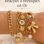 Bracelet charm en or élégant sur une table en bois.