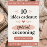 Un ensemble de cadeaux cocooning comprenant un plaid, une bougie et un livre dans un cadre cosy