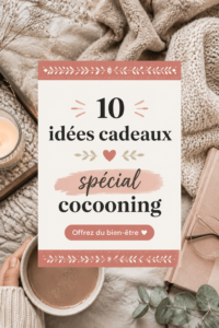Un ensemble de cadeaux cocooning comprenant un plaid, une bougie et un livre dans un cadre cosy