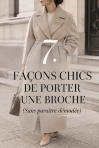 Femme élégante portant une broche moderne sur un manteau chic.