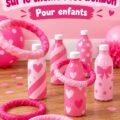 Une table décorée pour une fête sur le thème Barbie avec des décorations roses